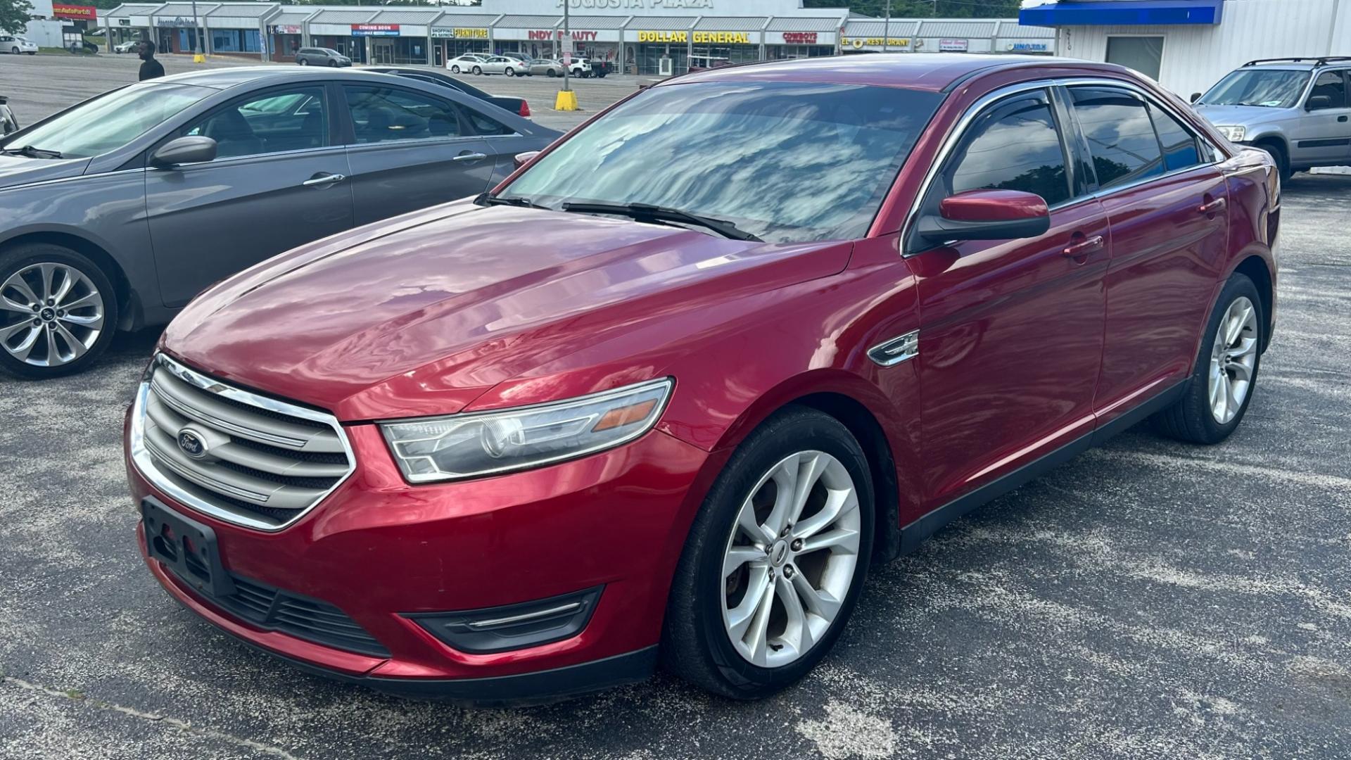 2013 RED /BEIGE Ford Taurus SEL (1FAHP2H83DG) with an 3.5L V6 OHV 16V FFV engine, 6-Speed Automatic transmission, located at 2710A Westlane Rd., Indianapolis, IN, 46268, (317) 291-2000, 39.885670, -86.208160 - Photo#0